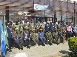 Brig. Gen David Gonyi, the Chief of Staff of Air Force with members of the East African Integrated Force during the launch of a two-weeks Mission Planning course at the United Nations Regional Service Centre in Entebbe