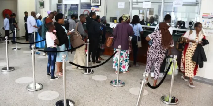 Travelers lining up at an Immigration office