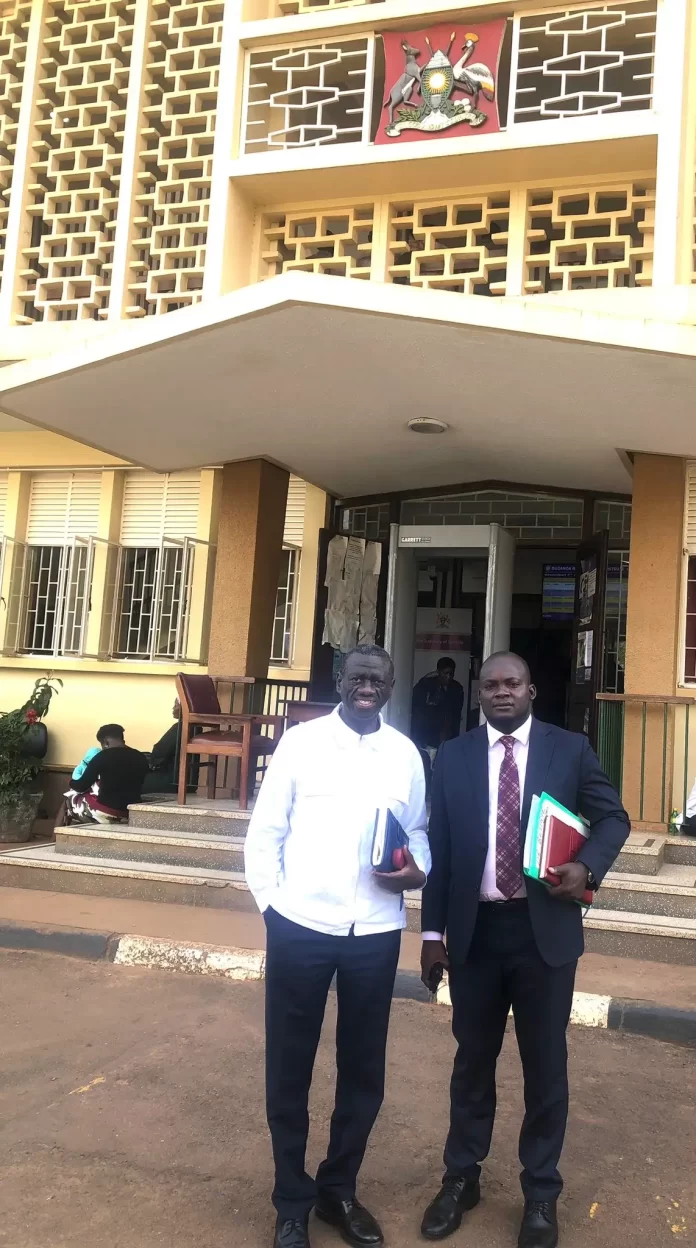 Rt. Col. Dr. Kizza Besigye (Right) with his Lawyer, Counsel Musa Matovu