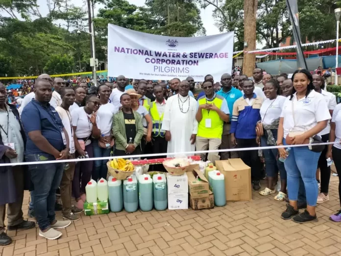 National Water and Sewerage Corporation team presenting the gifts to Rev. Fr. Vincent Lubega, the Rector at Namugongo Catholic Martyrs Shrine
