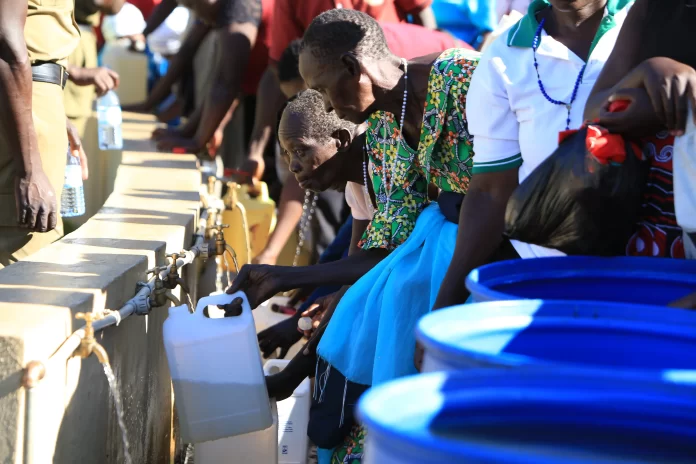 Pilgrims fetching the Holy water from the well at Namugongo Martyrs Catholic Shrine