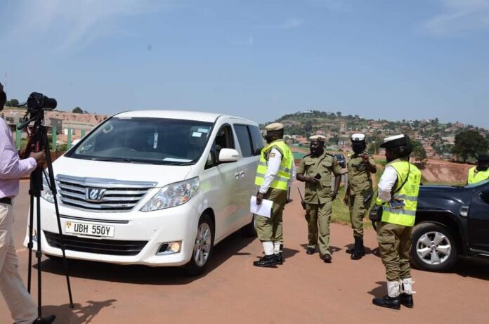 Traffic Police Officers inspecting a car
