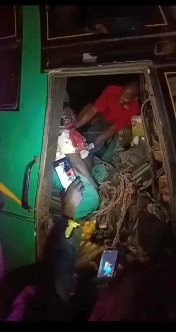 A Link bus driver being removed from bus after the accident