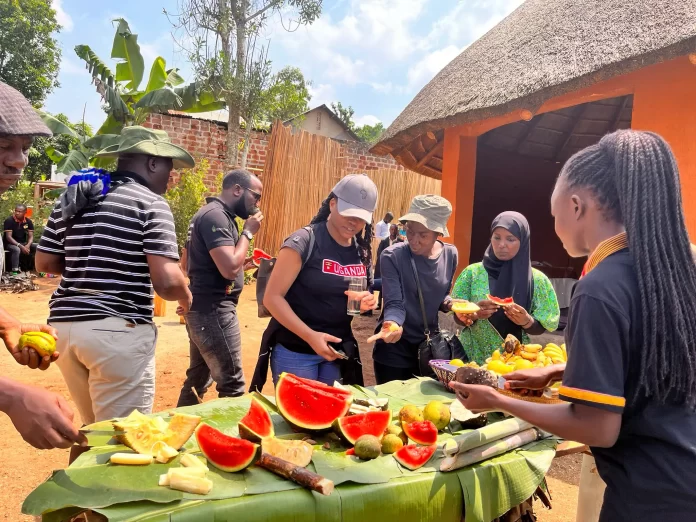 Some of the revelers being served fruits at Ewaffe Cultural Village