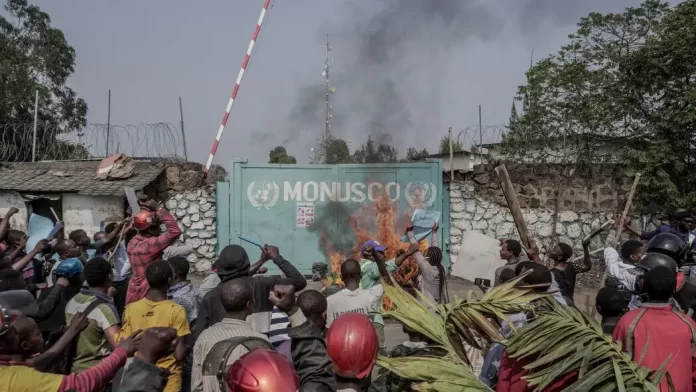 Congolese protesters set the MONUSCO signpost on fire